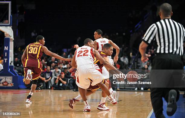 Jarrett Mann of the Stanford Cardinal tries to control the ball from Julian Welch of the Minnesota Golden Golphers in the second half during the NIT...