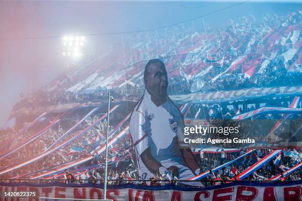 Fans of Nacional make a tribute to Santiago Garcia during a match between Nacional and Peñarol as part of Torneo Clausura 2022 at Gran Parque Central...
