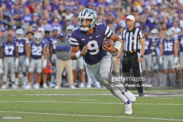 Quarterback Adrian Martinez of the Kansas State Wildcats runs for a touchdown during the first half against the South Dakota Coyotes at Bill Snyder...
