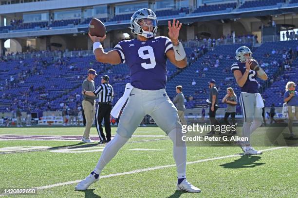 Quarterback Adrian Martinez of the Kansas State Wildcats works out before a game against the South Dakota Coyotes at Bill Snyder Family Football...