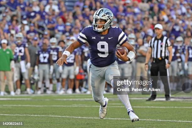 Quarterback Adrian Martinez of the Kansas State Wildcats runs for a touchdown during the first half against the South Dakota Coyotes at Bill Snyder...