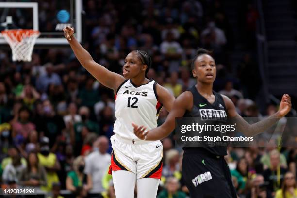 Chelsea Gray of the Las Vegas Aces reacts after her three-point basket next to Jewell Loyd of the Seattle Storm in overtime of Game Three of the 2022...