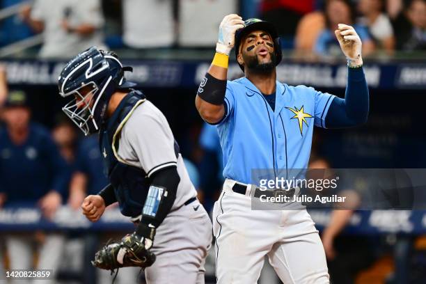 Yandy Diaz of the Tampa Bay Rays reacts to a strikeout to lose the game 2-1 against the New York Yankees at Tropicana Field on September 04, 2022 in...