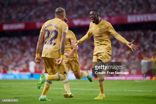 Raphael Dias Belloli 'Raphinha' of FC Barcelona celebrates scoring their teams first goal with team mates during the LaLiga Santander match between...