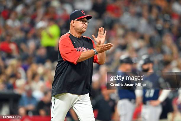 Manager Terry Francona of the Cleveland Guardians walks to the mound for a pitching change during the fifth inning against the Seattle Mariners at...