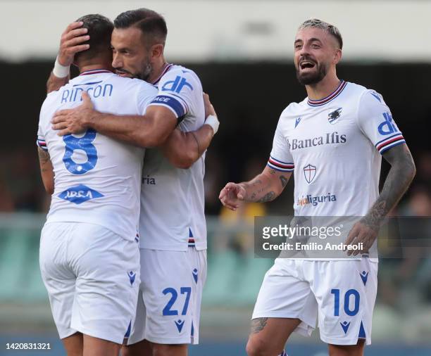 Francesco Caputo of UC Sampdoria celebrates with his team-mates Fabio Quagliarella and Tomas Rincon after scoring the opening goal during the Serie A...