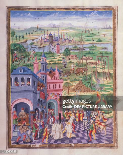 Capital punishments and torture in an imaginary medieval town, miniature from De Sphaera by Leonardo Dati, manuscript Italy. ; Modena, Biblioteca...