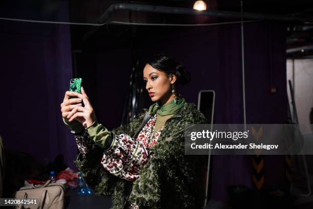 female portrait of fashion woman at the backstage of fashion week show. lifestyle photography, behind the scenes of new clothing collection. girl wear by fashion designer. haute couture photo. - fashion show backstage stock pictures, royalty-free photos & images