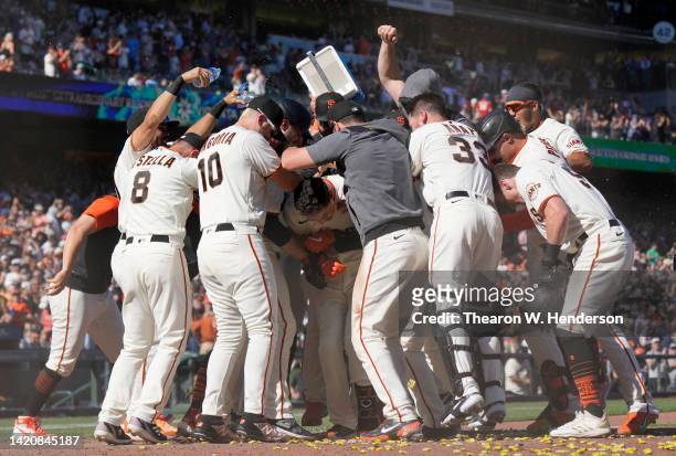 Wilmer Flores of the San Francisco Giants celebrates his two-run, walk-off home run against the Philadelphia Phillies in the bottom of the ninth...