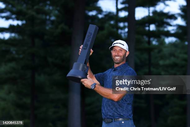Team Captain Dustin Johnson of 4 Aces GC poses with the trophy after winning the individual championship in a playoff during Day Three of the LIV...