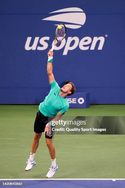 Pablo Carreno of Spain serves against Karen Khachanov of Russia during their Men's Singles Fourth Round match on Day Seven of the 2022 US Open at...