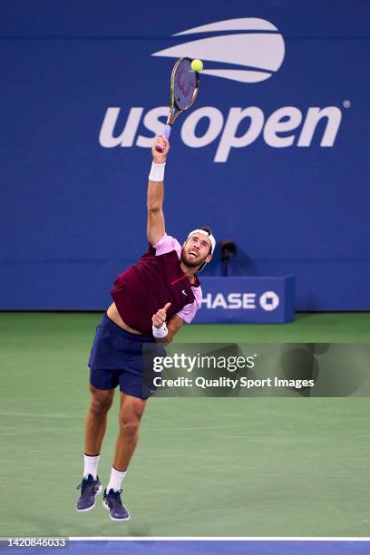 Karen Khachanov of Russia serves against Pablo Carreno of Spain during their Men's Singles Fourth Round match on Day Seven of the 2022 US Open at...
