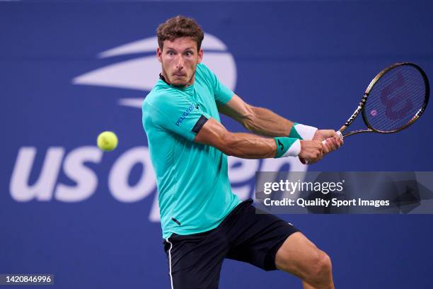 Pablo Carreno of Spain plays a backhand against Karen Khachanov of Russia during their Men's Singles Fourth Round match on Day Seven of the 2022 US...