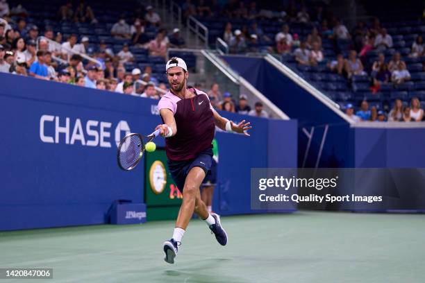 Karen Khachanov of Russia returns a ball to against Pablo Carreno of Spain during their Men's Singles Fourth Round match on Day Seven of the 2022 US...