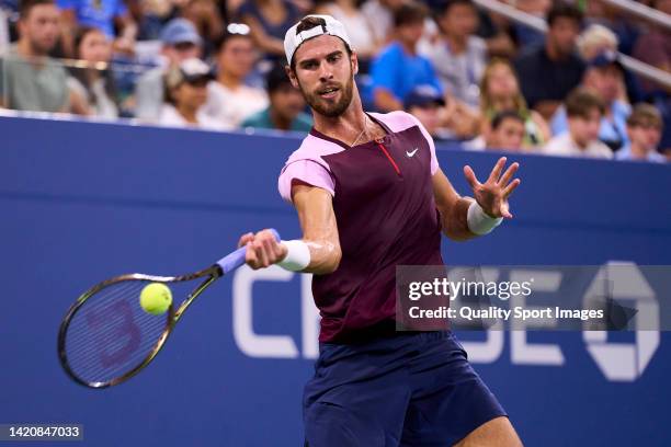 Karen Khachanov of Russia returns a ball to against Pablo Carreno of Spain during their Men's Singles Fourth Round match on Day Seven of the 2022 US...
