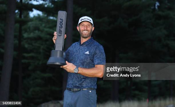Dustin Johnson of the the United States holds the winner's trophy after winning the LIV Golf Invitational - Boston at The Oaks golf course at The...