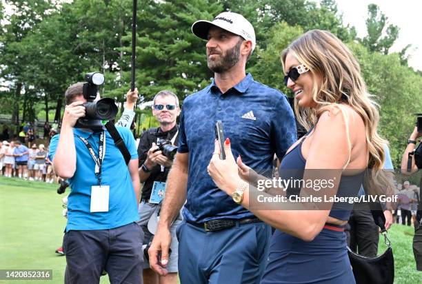 Team Captain Dustin Johnson of 4 Aces GC celebrates with wife, Paulina Gretzky, after winning the LIV Golf Invitational - Boston in a playoff at The...