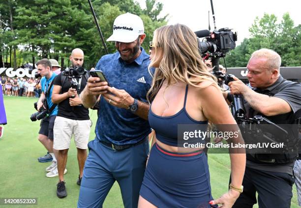 Team Captain Dustin Johnson of 4 Aces GC celebrates with wife, Paulina Gretzky, after winning the LIV Golf Invitational - Boston in a playoff at The...