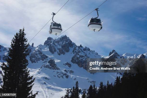 bubble cars to and from the mountains - courchevel stockfoto's en -beelden