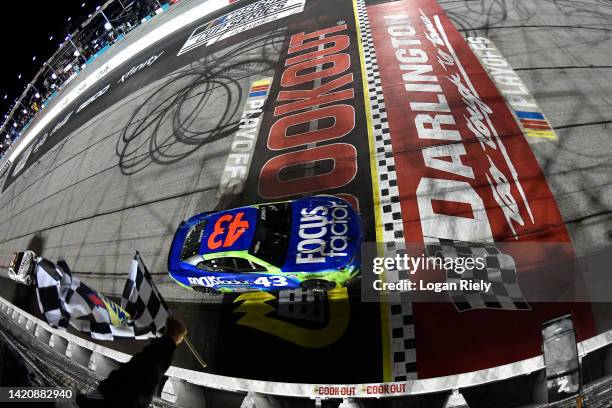 Erik Jones, driver of the FOCUSfactor Chevrolet, takes the checkered flag to win the NASCAR Cup Series Cook Out Southern 500 at Darlington Raceway on...