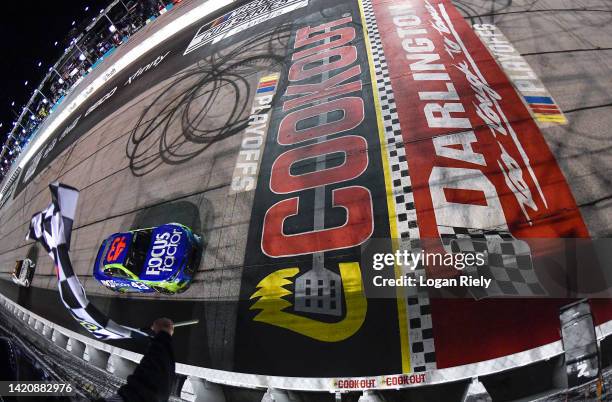 Erik Jones, driver of the FOCUSfactor Chevrolet, takes the checkered flag to win the NASCAR Cup Series Cook Out Southern 500 at Darlington Raceway on...