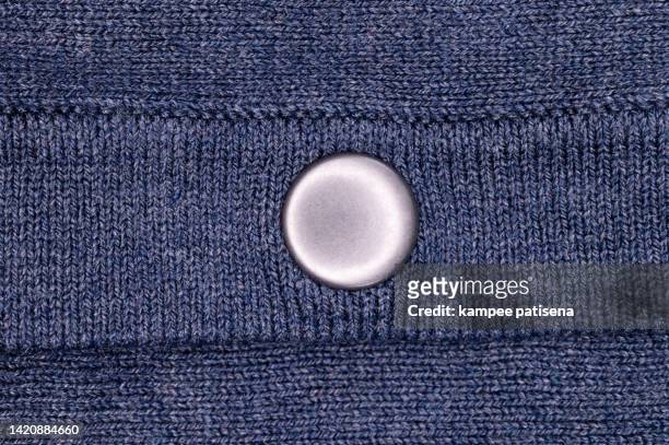 blue cotton fabric with button - button sewing item stock-fotos und bilder