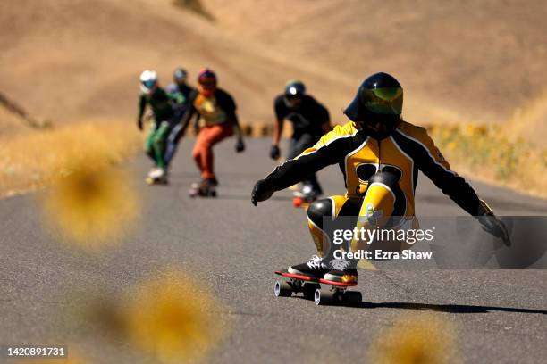 Skateboarders ride down the Maryhill Loops Road during the Maryhill Ratz Freeride on September 04, 2022 in Maryhill, Washington. The Maryhill Ratz...