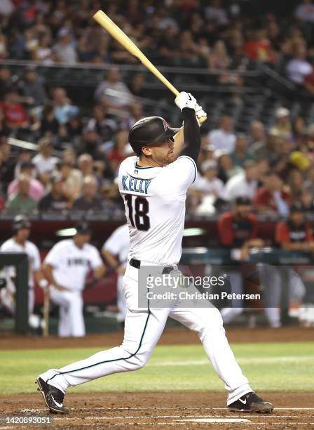Carson Kelly of the Arizona Diamondbacks bats against the Philadelphia Phillies during the MLB game at Chase Field on August 30, 2022 in Phoenix,...