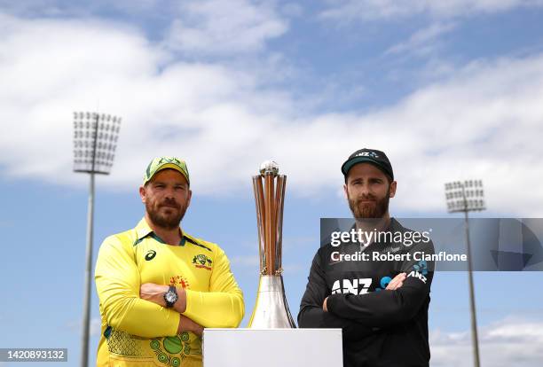 Aaron Finch of Australia and Kane Williamson of New Zealand pose with the Chappell-Hadlee Trophy during a media opportunity at Cazaly's Stadium on...