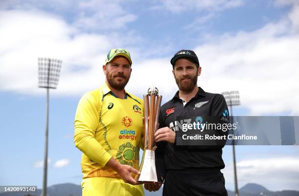 Aaron Finch of Australia and Kane Williamson of New Zealand pose with the Chappell-Hadlee Trophy during a media opportunity at Cazaly's Stadium on...