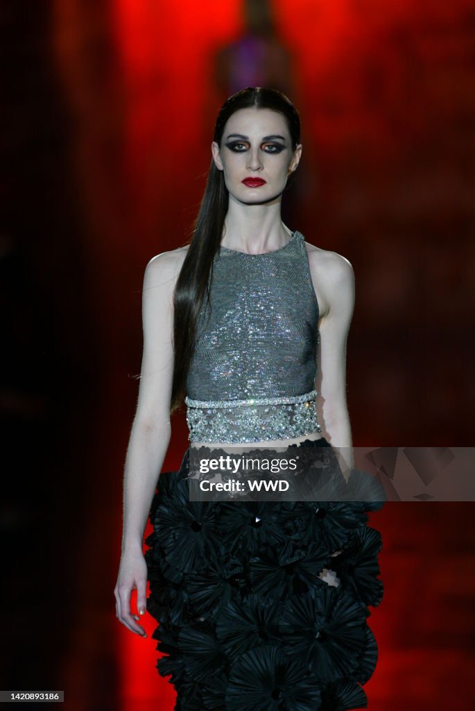 Models 2003 A model walks down the runway at the Spring 2003 Valentino show in ...