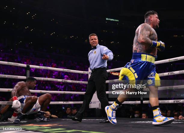 Andy Ruiz Jr. Heads to a corner as directed by referee Thomas Taylor after knocking down of Luis Ortiz on his way to a unanimous decision win during...