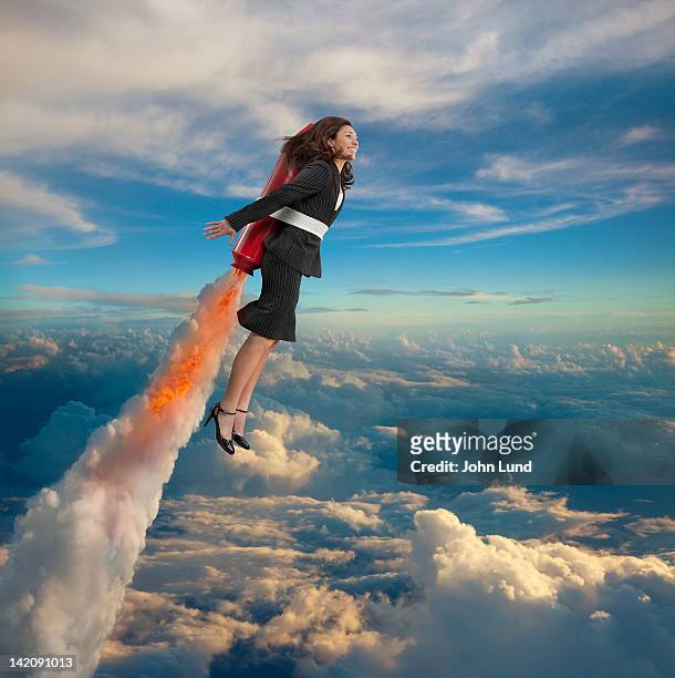 woman rocketing to success - vehicle brand name stockfoto's en -beelden