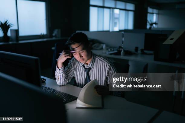 young businessman work late night stress out with project. - suspicion employee stock pictures, royalty-free photos & images