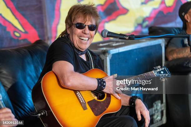 Musician George Thorogood gives an interview and performs with his guitar during the Pain In The Grass music festival presented by 99.9 KISW at White...