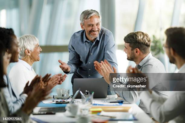 congratulating on successful business meeting! - applauding leader stock pictures, royalty-free photos & images