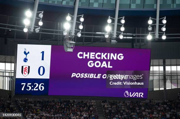 Checking goal, possible offside message on the stadium electronic screen prior to the Premier League match between Tottenham Hotspur and Fulham FC at...