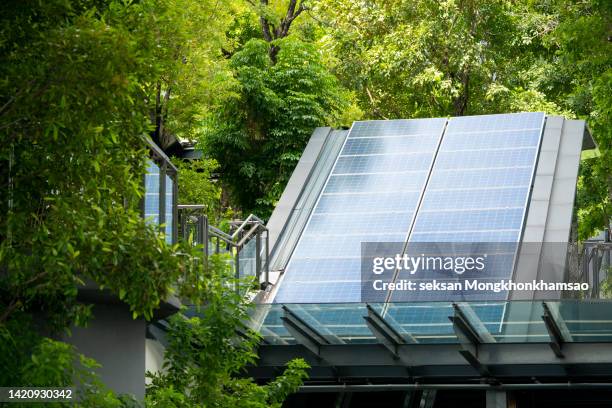 rooftop solar installation with city center view - battery storage stock pictures, royalty-free photos & images