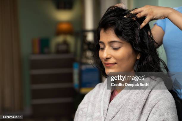 woman hair massage at home, stock photo - ayurveda stock pictures, royalty-free photos & images