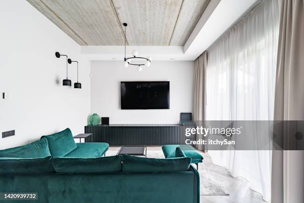modern living room with flat screen tv - flat screen stock pictures, royalty-free photos & images