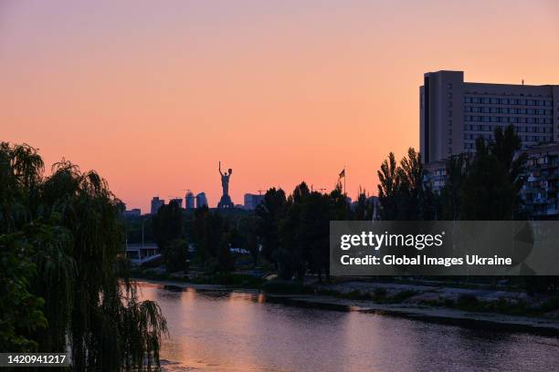 View of evening skyline with the Motherland Monument and embankment of the Rusanivskyi Canal on August 19, 2022 in Kyiv, Ukraine. The threat of...