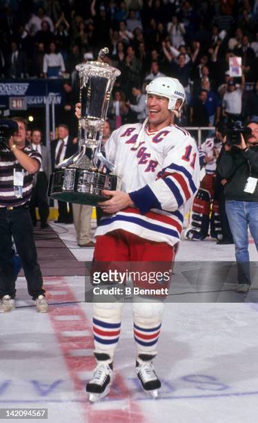 Mark Messier of the New York Rangers holds the Eastern Conference Championship Trophy after the Rangers defeated the New Jersey Devils in Game 7 of...