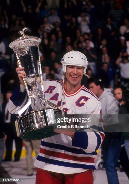 Mark Messier of the New York Rangers holds the Eastern Conference Championship Trophy after the Rangers defeated the New Jersey Devils in Game 7 of...