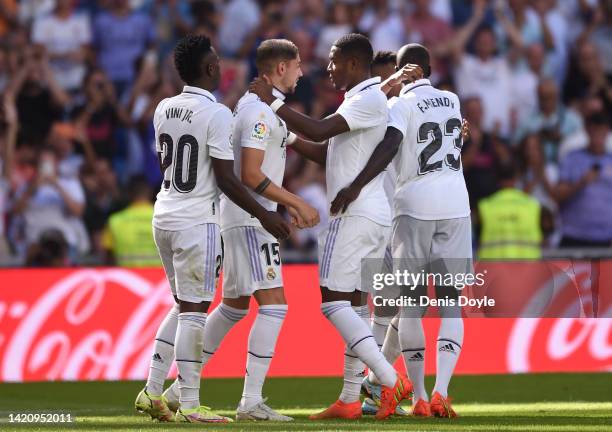 David Alaba of Real Madrid celebrates with Federico Valverde after their team scored their second goal during the LaLiga Santander match between Real...