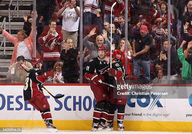 Radim Vrbata of the Phoenix Coyotes celebrates with Ray Whitney and Martin Hanzal after scoring a third period goal against the San Jose Sharks...