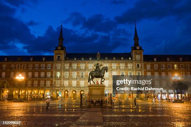 plaza mayor at dusk just after a rain storm in madrid, spain. - plaza mayor madrid stock pictures, royalty-free photos & images