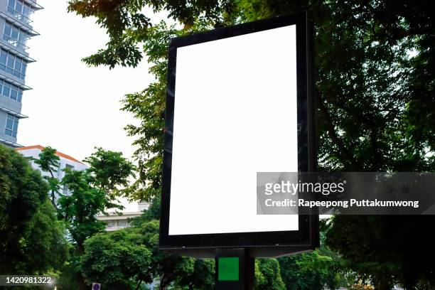 blank street billboard poster stand in urban park - bill posting stock pictures, royalty-free photos & images