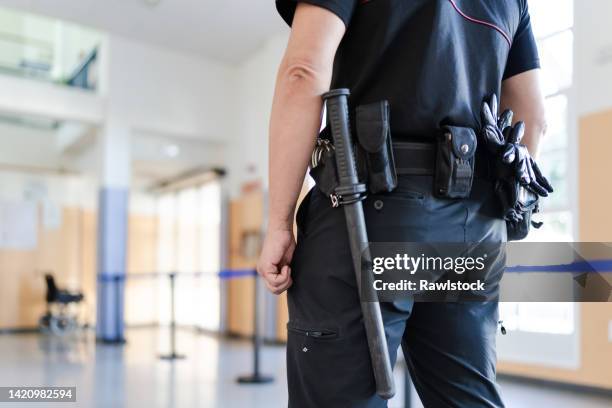close-up of unrecognizable security staff. - uniforme della polizia foto e immagini stock