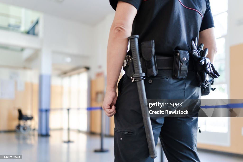 Close-up of unrecognizable security staff.