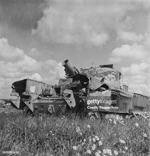Avre Tank Exploding A wrecked British Army Churchill AVRE tank stands in a field beside ...